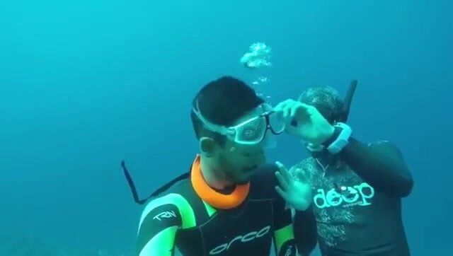 Arab freedivers ripping masks underwater