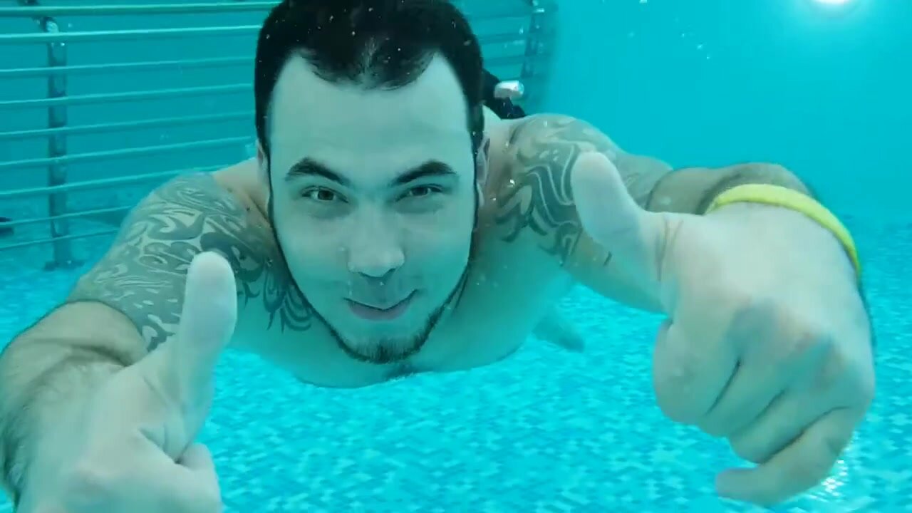 Cute swimmer barefaced underwater