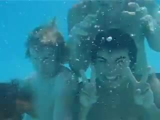 Underwater barefaced buddies in pool - video 7