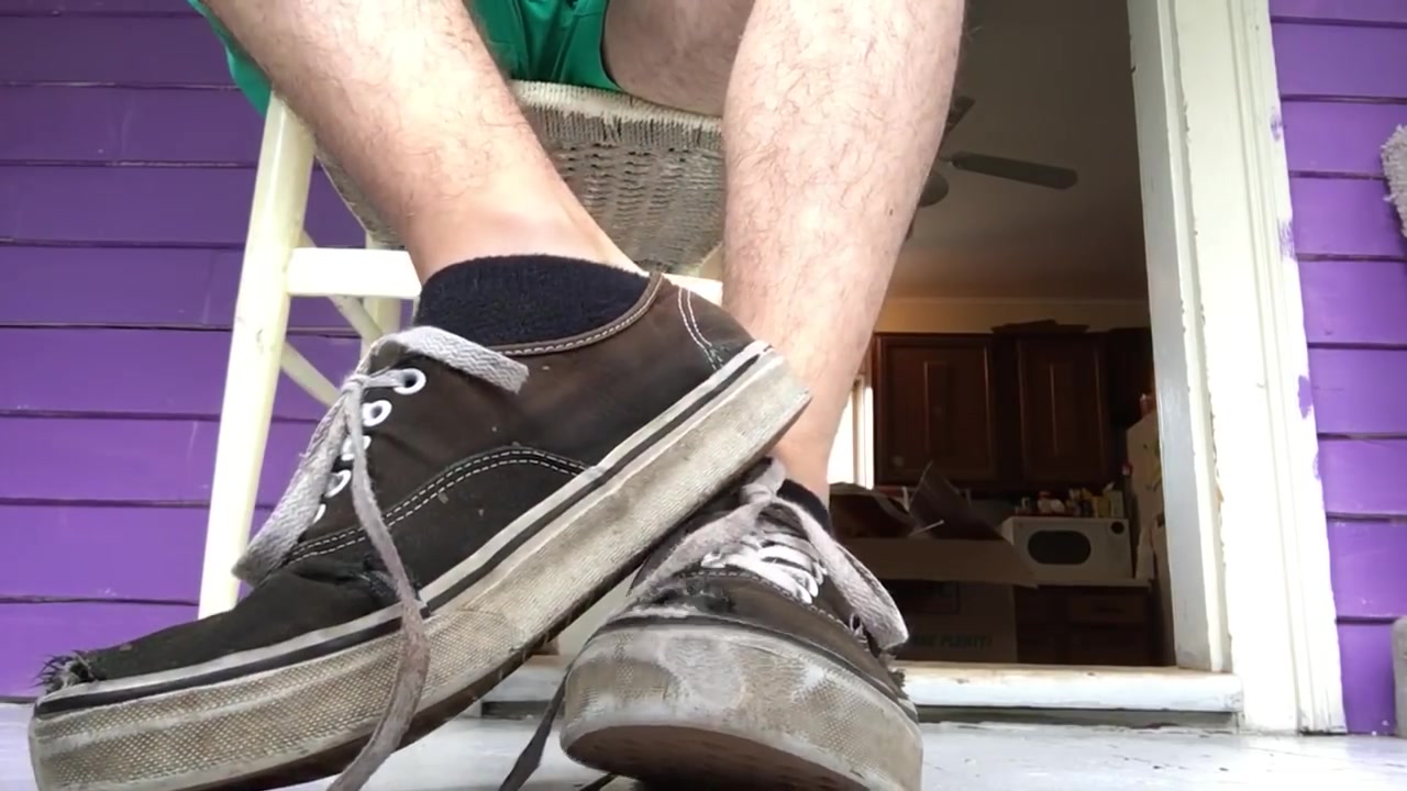 Under his vans and feet