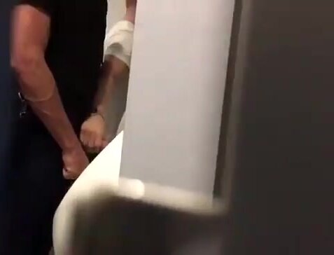 Getting a handjob from a stranger at the urinal