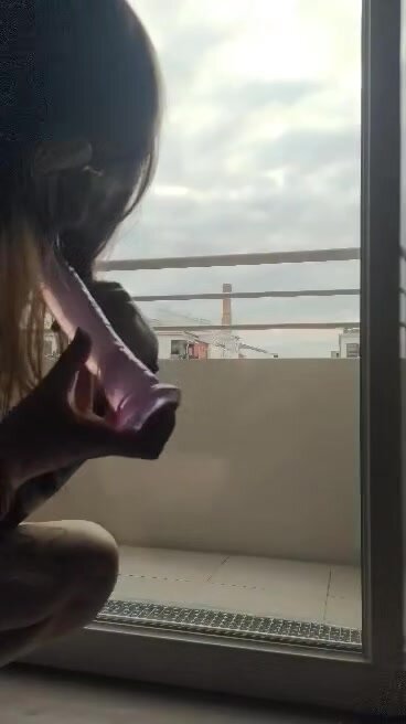 Mae Fucks her Ass Next to a  Glass Door