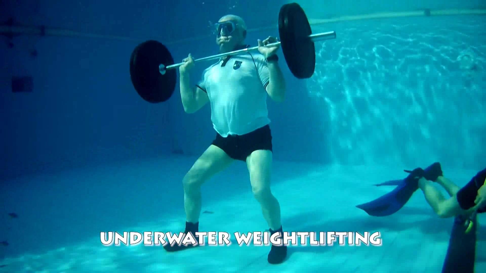 Beefy daddy weight lifting underwater