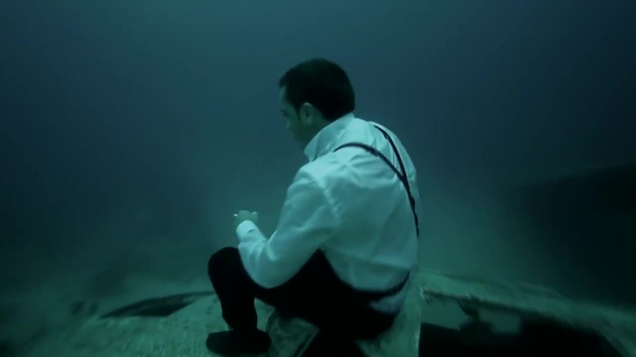 Underwater barefaced model in tuxedo