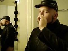 Dude smokes and jerks in leather jacket