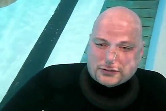 Swedish bald cutie singing barefaced underwater