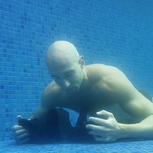 Bald hottie breatholding barefaced underwater - video 2