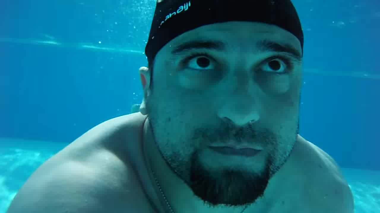 Underwater barefaced cute buddies in pool - video 2