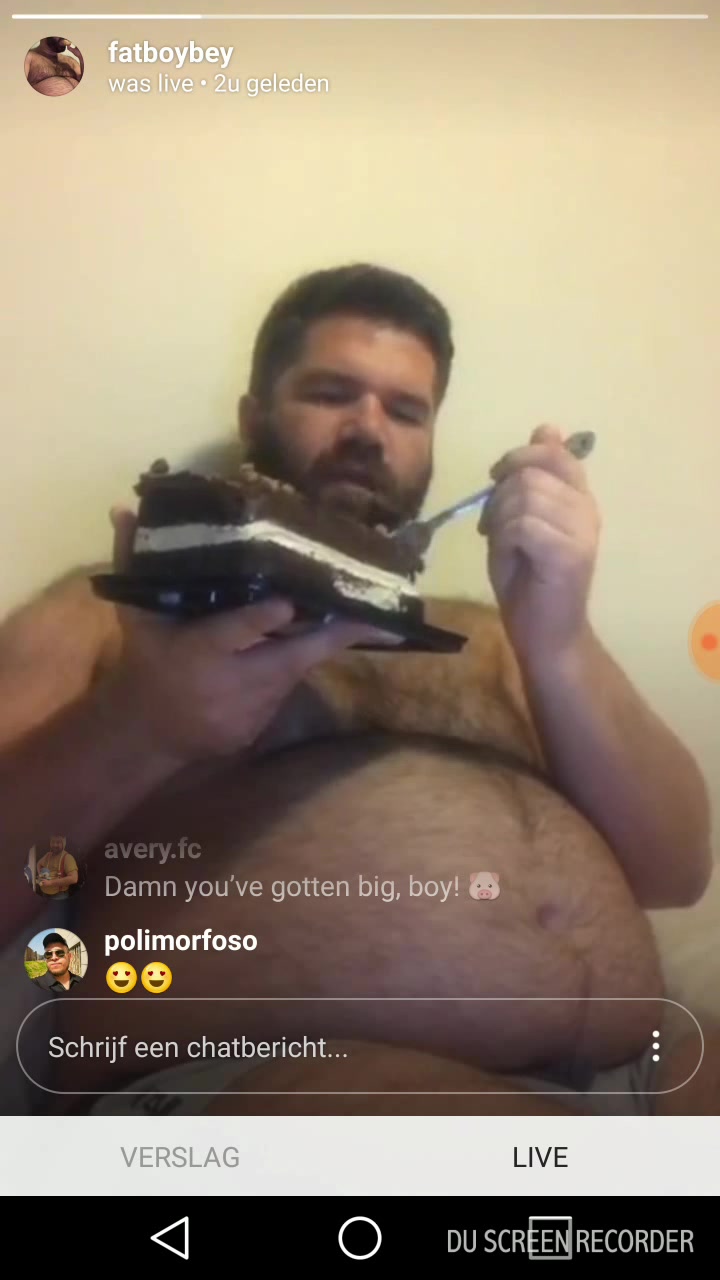 Fat man eats a big chocolate cake