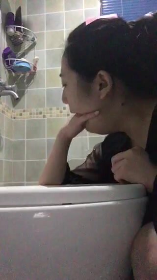 asian girl pukes cola in toilet 2