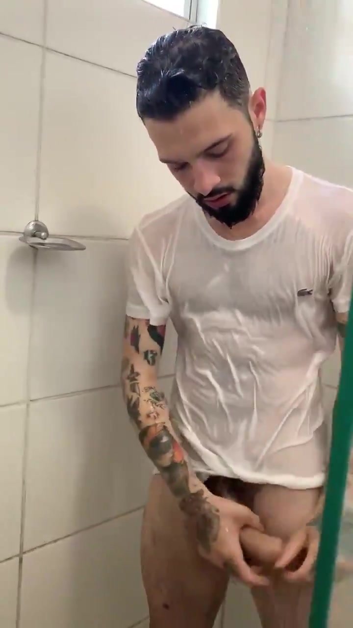 Handsome lad stroking his cock in the shower