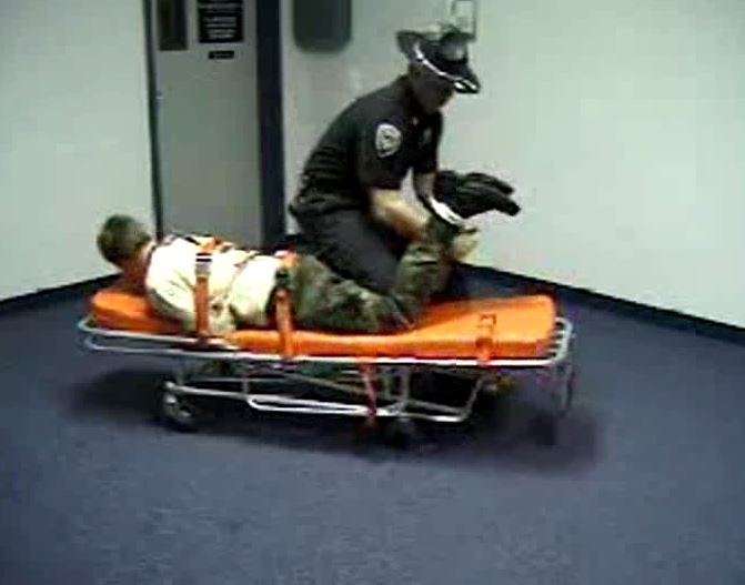 Academy cot strapped in