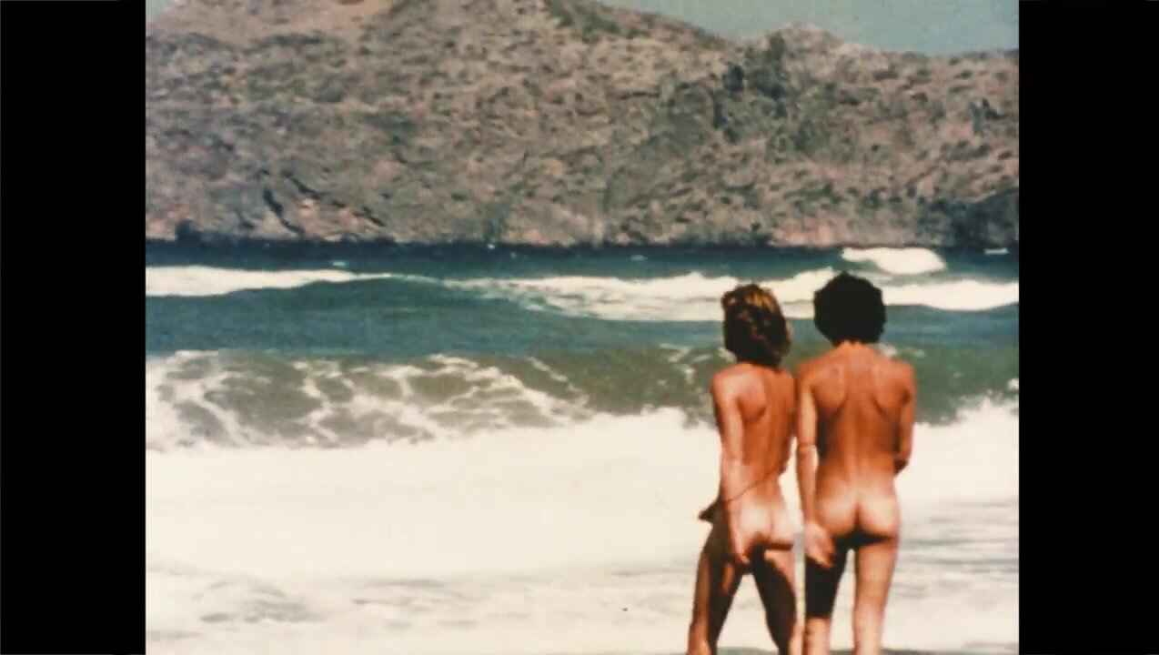 Vintage young gay couple in nudist beach