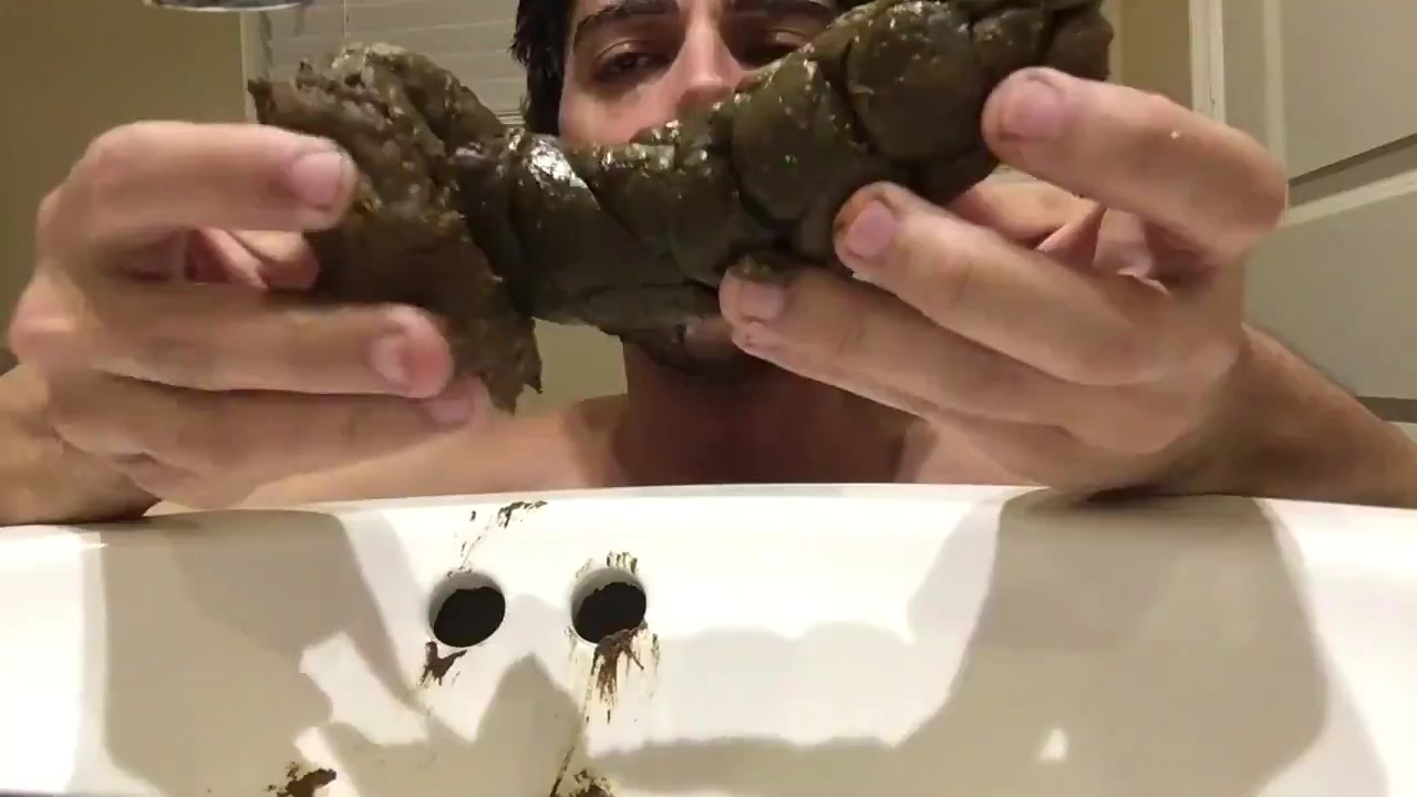 Playing with huge turd and eating