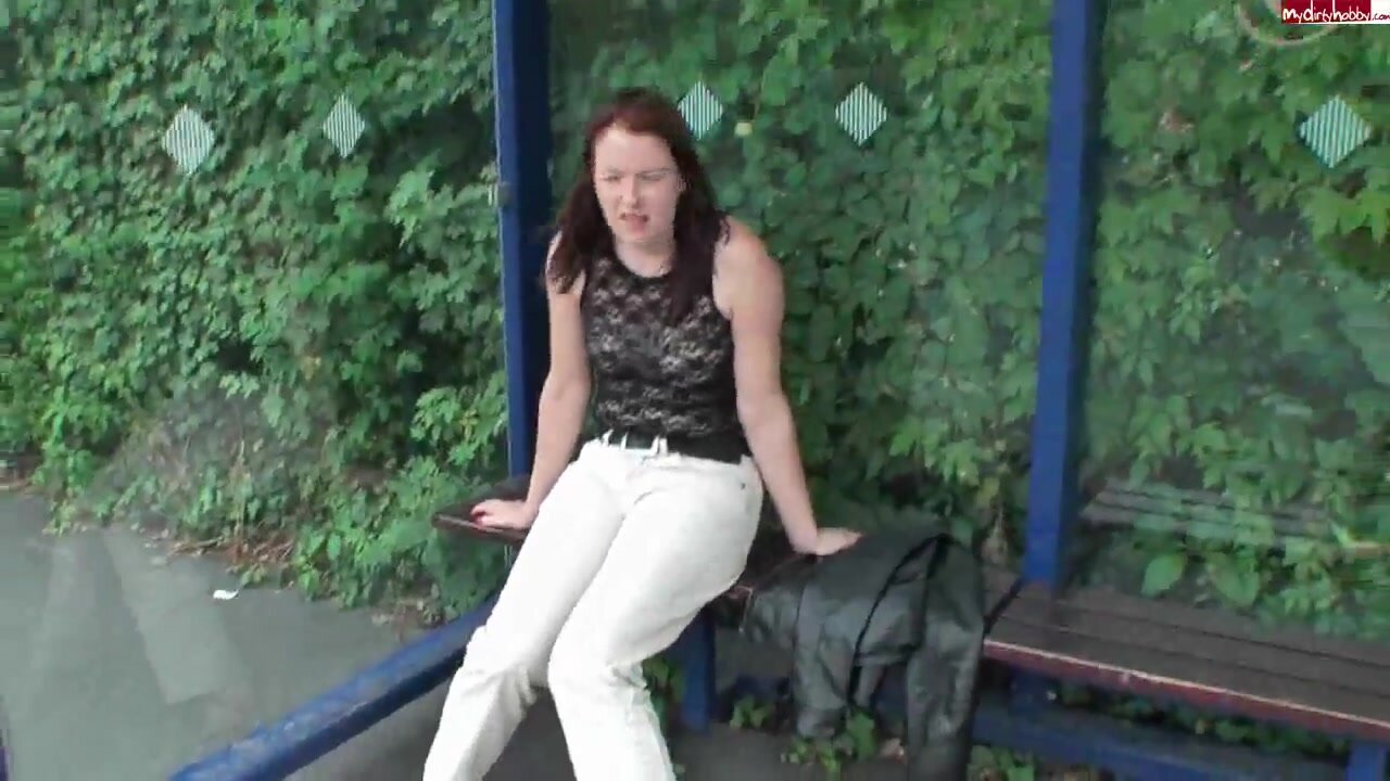 A SMILING GIRL PEES HER PANTS IN PUBLIC