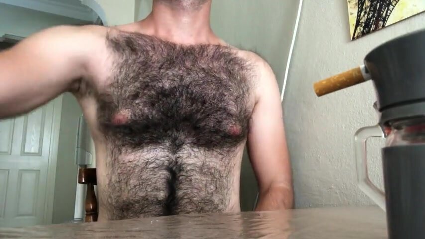 Hairy Daddy smokes, wanks and shoots some nice cum