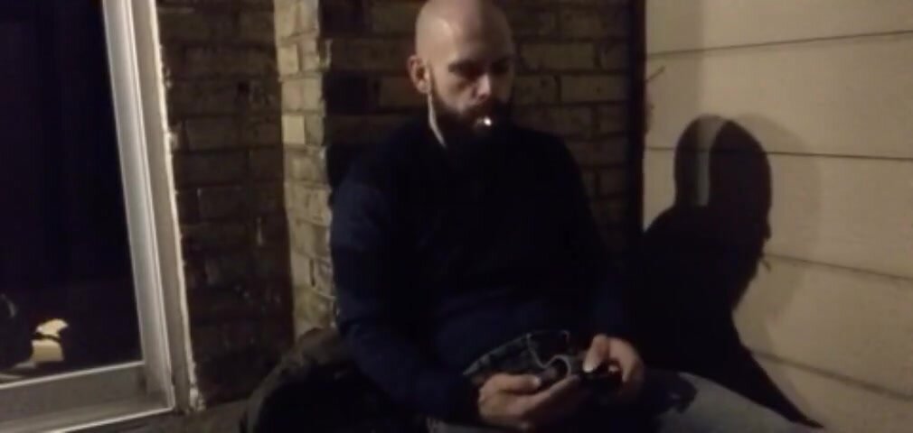 Guy goes outside by his garage for a smoke and wank
