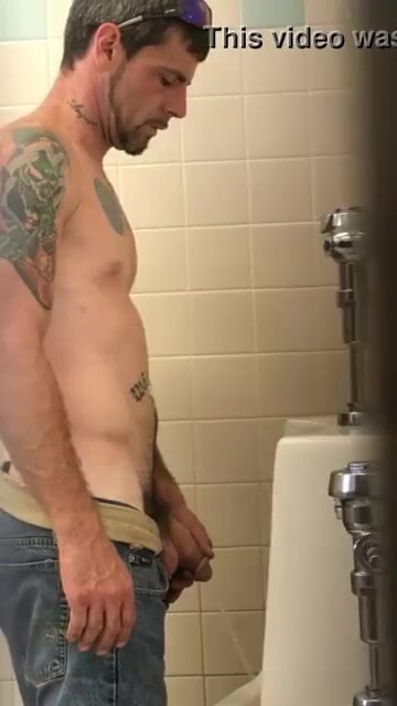 shirtless trucker at the urinal