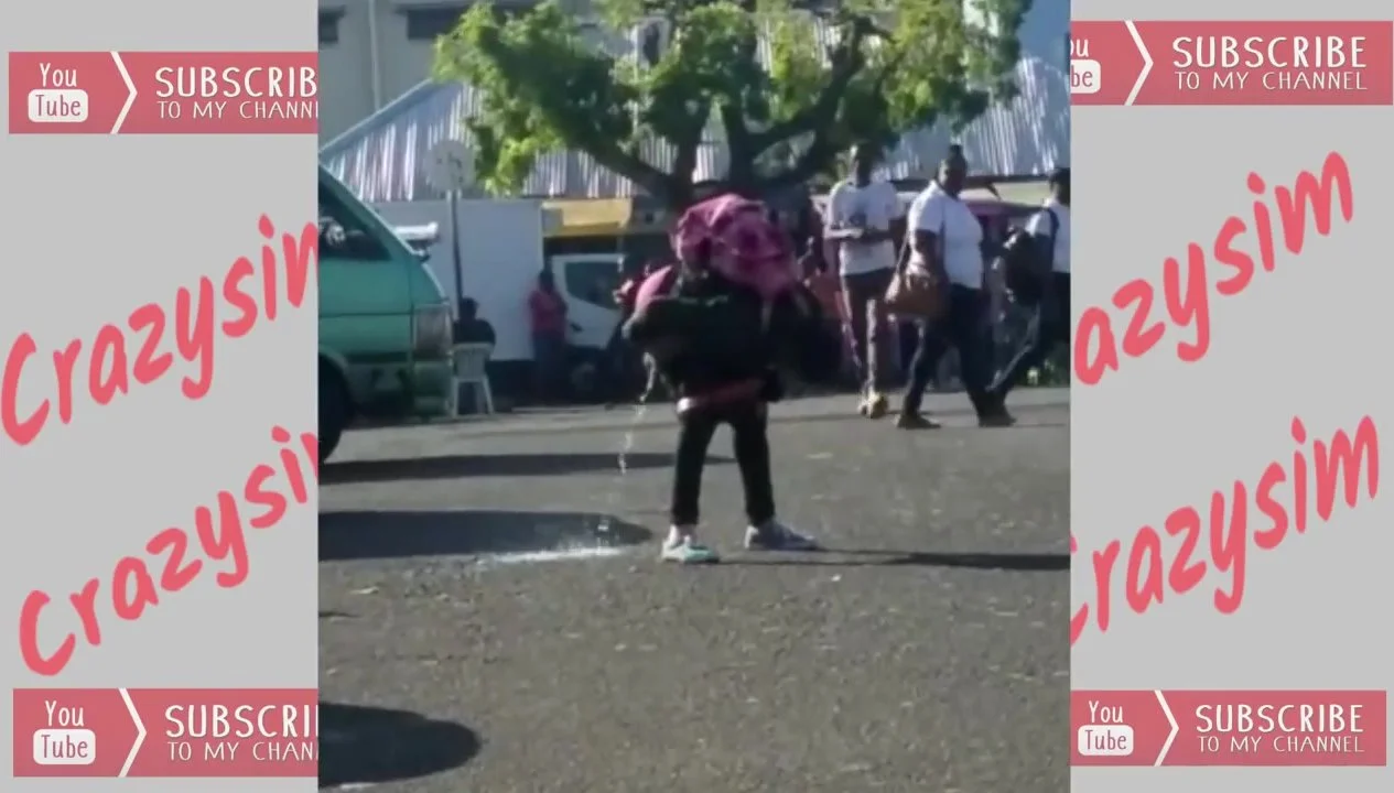 Woman Pissing Bend Over in Kingstown Street - ThisVid.com