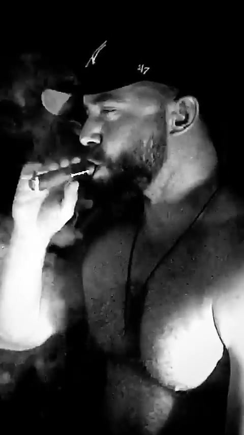 Hot bearded alpha guy sicking on a big cigar