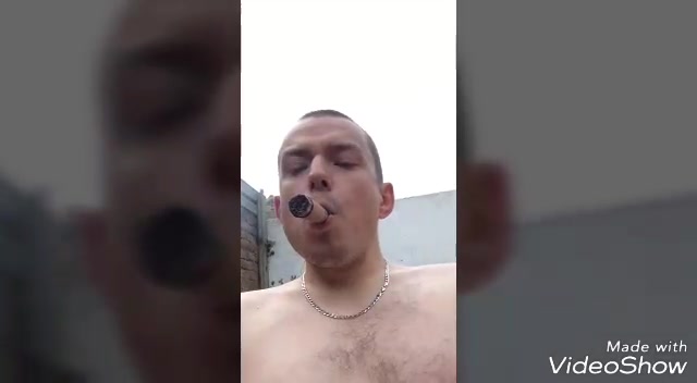 Super hot scruffy dude smoking a big cigar