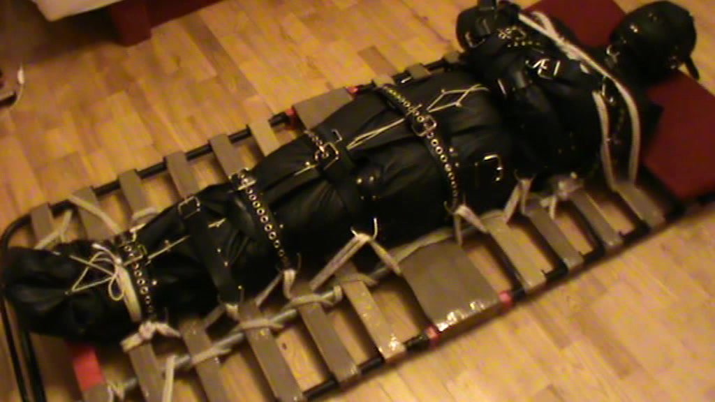 Restrained in the leather insane sack