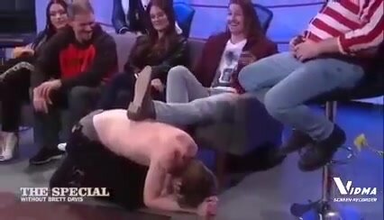 a human footstool on a TV Show
