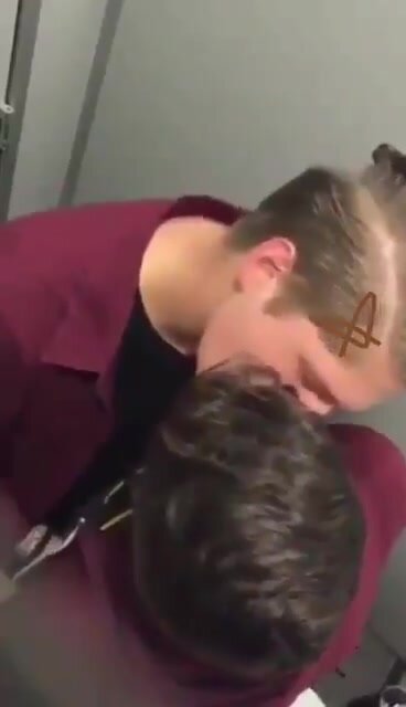 Twinks kiss secretly in a bathroom stall and fuck