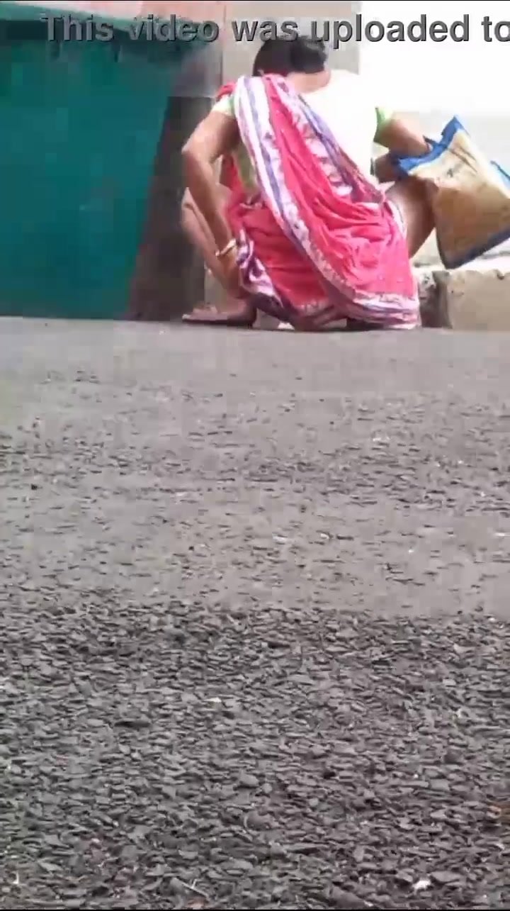 Desi aunty caught pee in public place - ThisVid.com