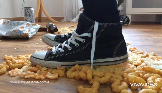 Girl crush food with sneakers.