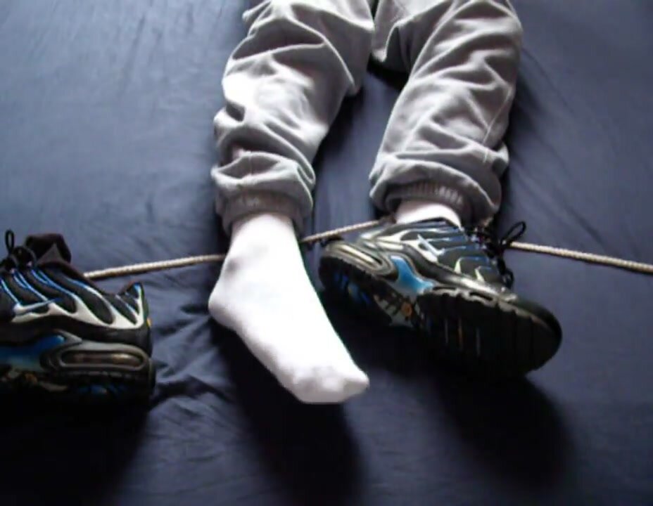 Tied socked feet - video 2