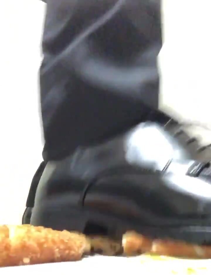 Male dress shoes crushing food - video 4