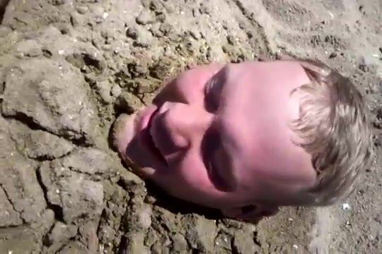 Guy buried in sand & tickled by girlfriend