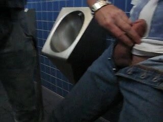 german guy pisses himself on urinal in public toilet