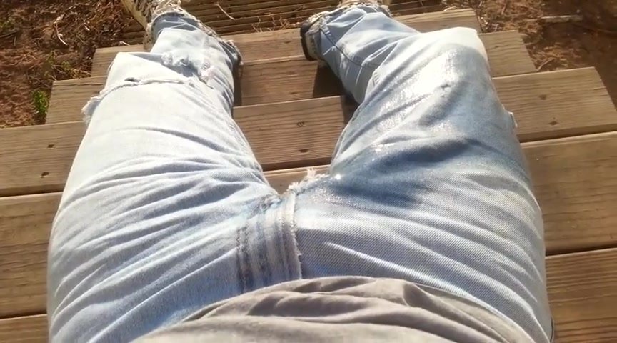 guy wets his jeans on porch