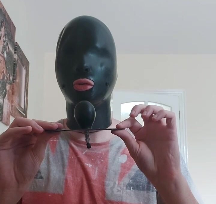 Rubber hood with inflatable gag and pup hood