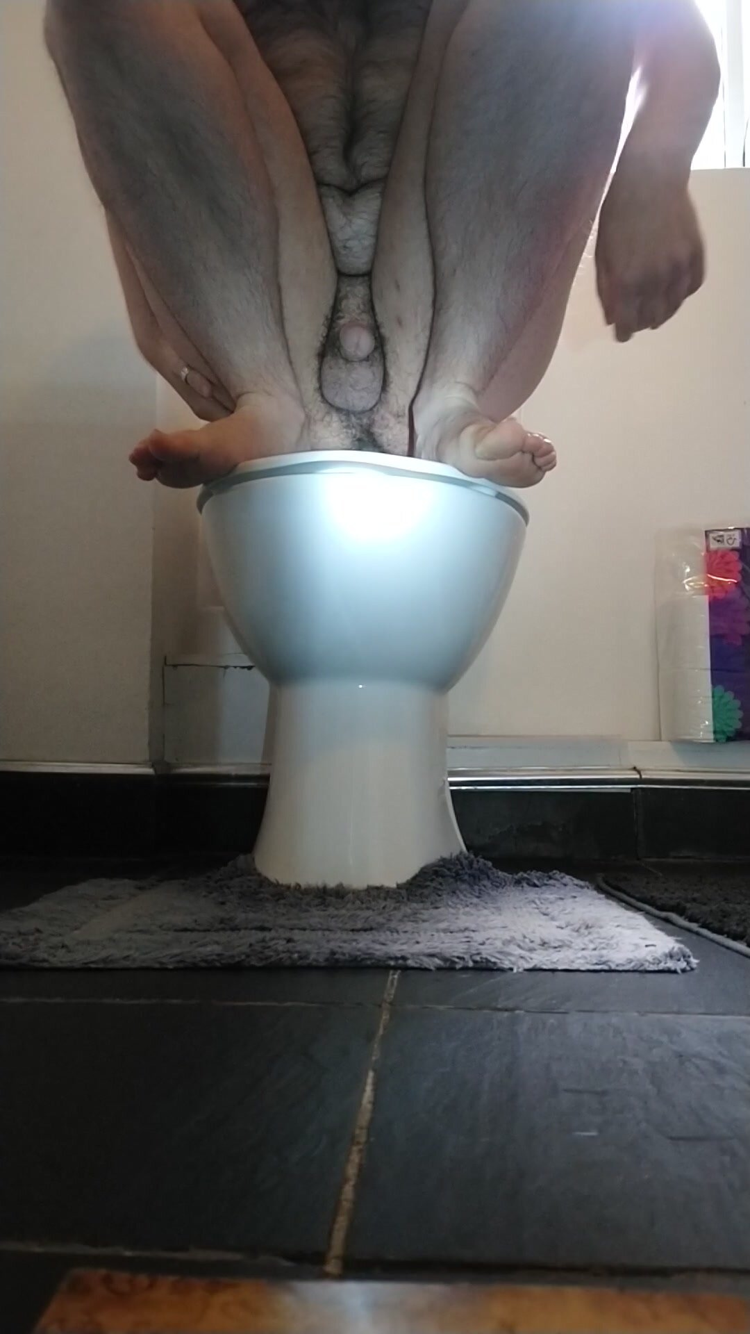 Hairy lad On the toilet with splash noises