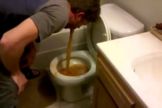 Guy Pukes All Over the Toilet