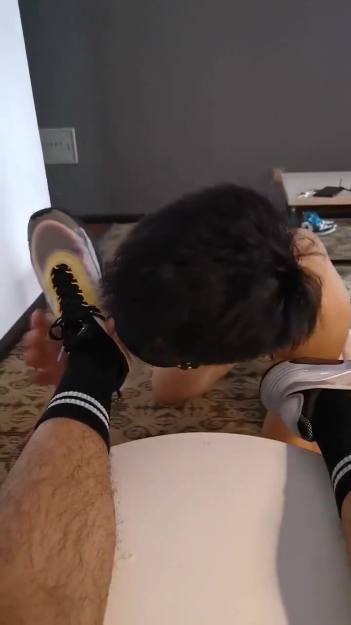 inferior slave licked his superior master's shoes