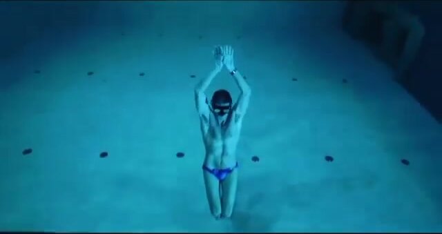 Italian freediver underwater in bulging speedo