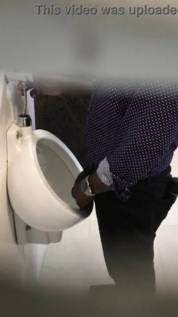big black cock having a slash at urinal