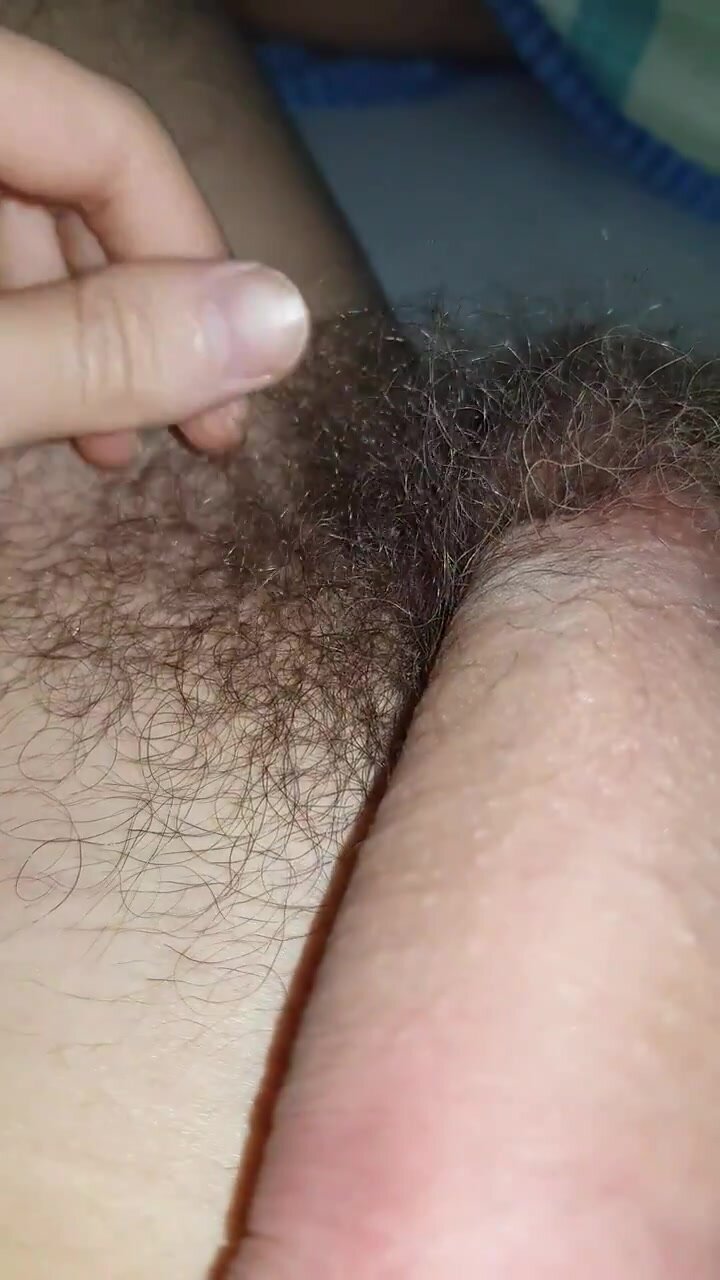 Hairy stud touches his pubes