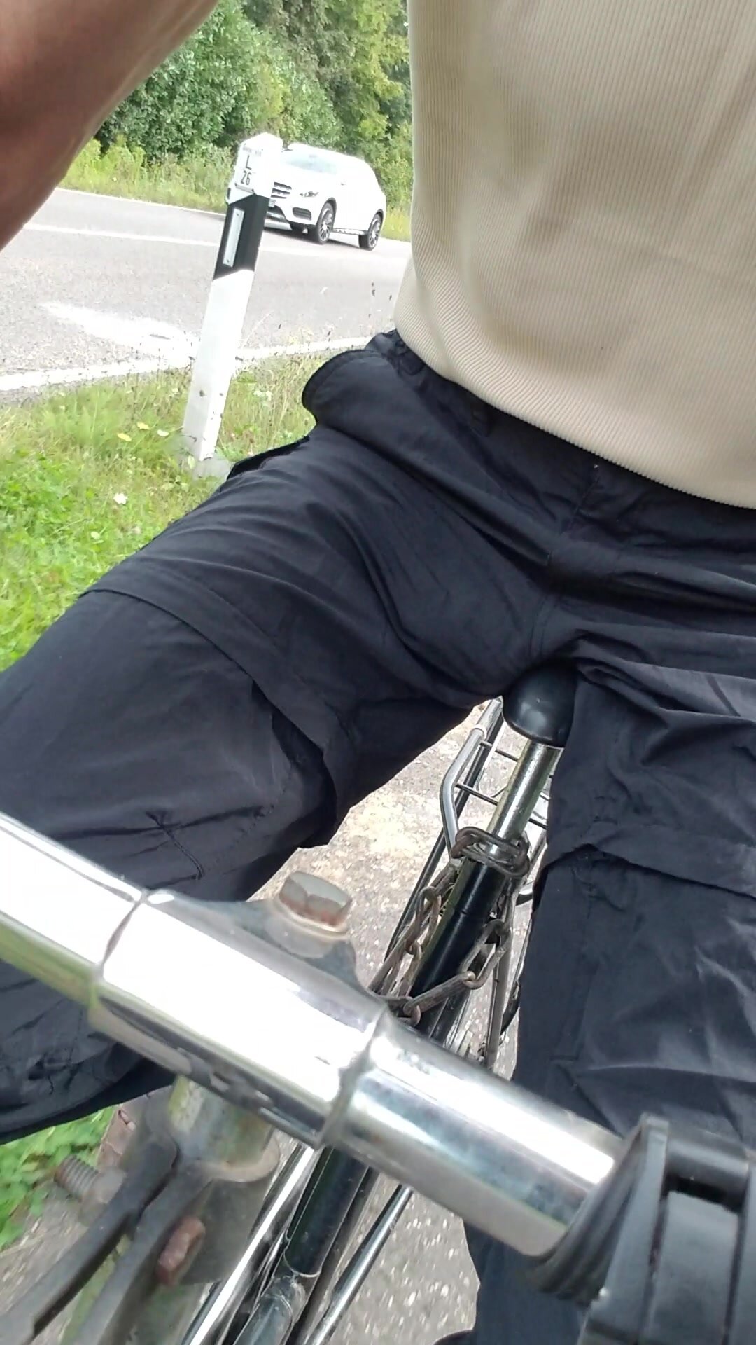 Piss in black trousers while bicycle trip