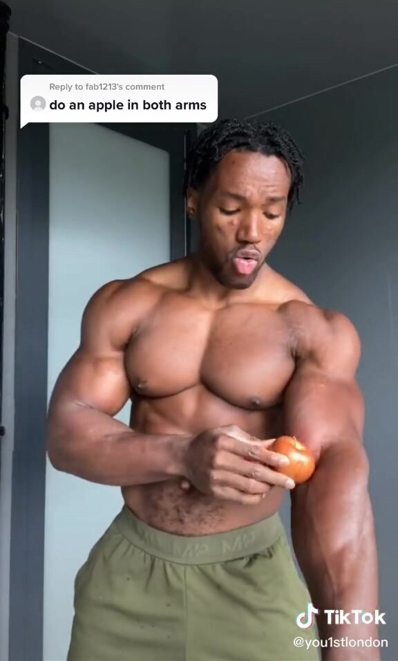 Bodybuilder crushes two apples with his biceps