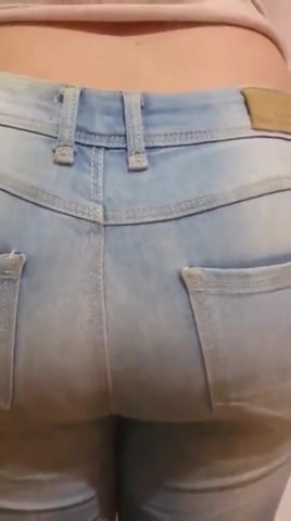 Pooping her diaper under jeans