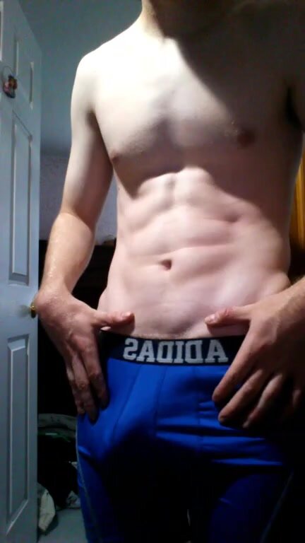 Teen muscle flexing bulge