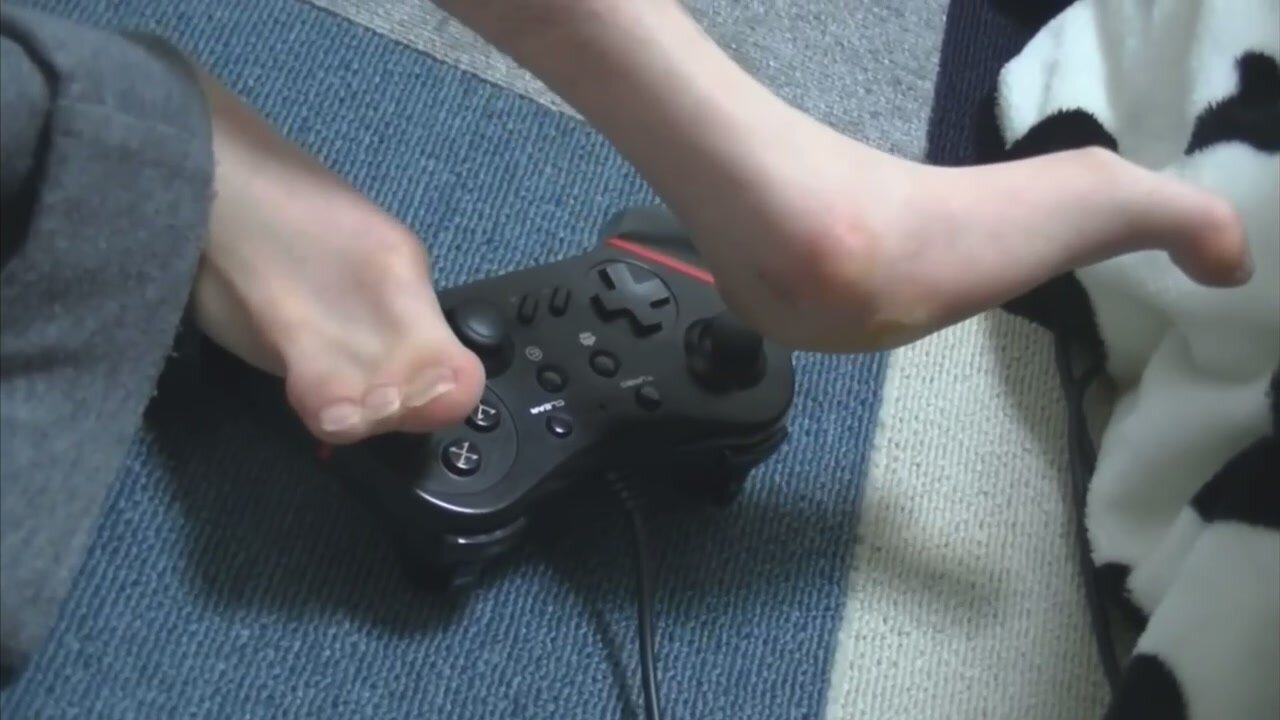 Boy playing games with his deformed feets