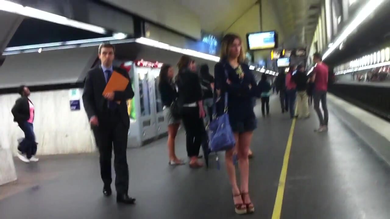 Girl in trainstation in sexy wedges