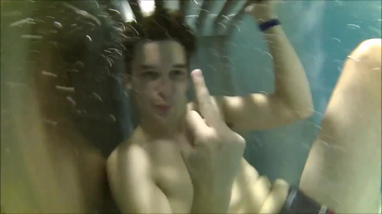 Underwater barefaced buddies in bulging speedos