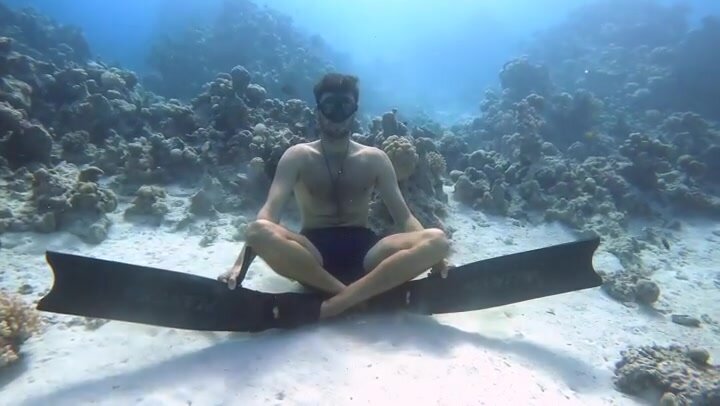 Underwater yoga pose at the bottom